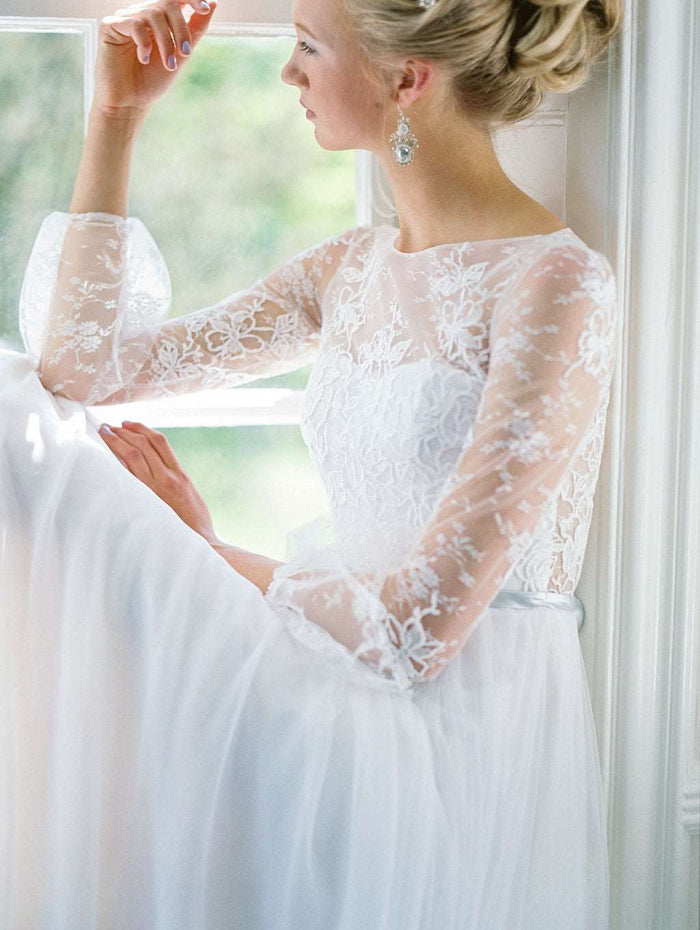 Romantic tulle wedding dress with boat neckline and long lace sleeves. Custom designed by Catherine Langlois, Toronto, Ontario, Canada.