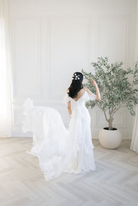 Custom made wedding dresses, Toronto. Romantic off the shoulder ruffled chiffon wedding dress. Detachable train. Custom designed Canadian wedding gowns by Catherine Langlois.