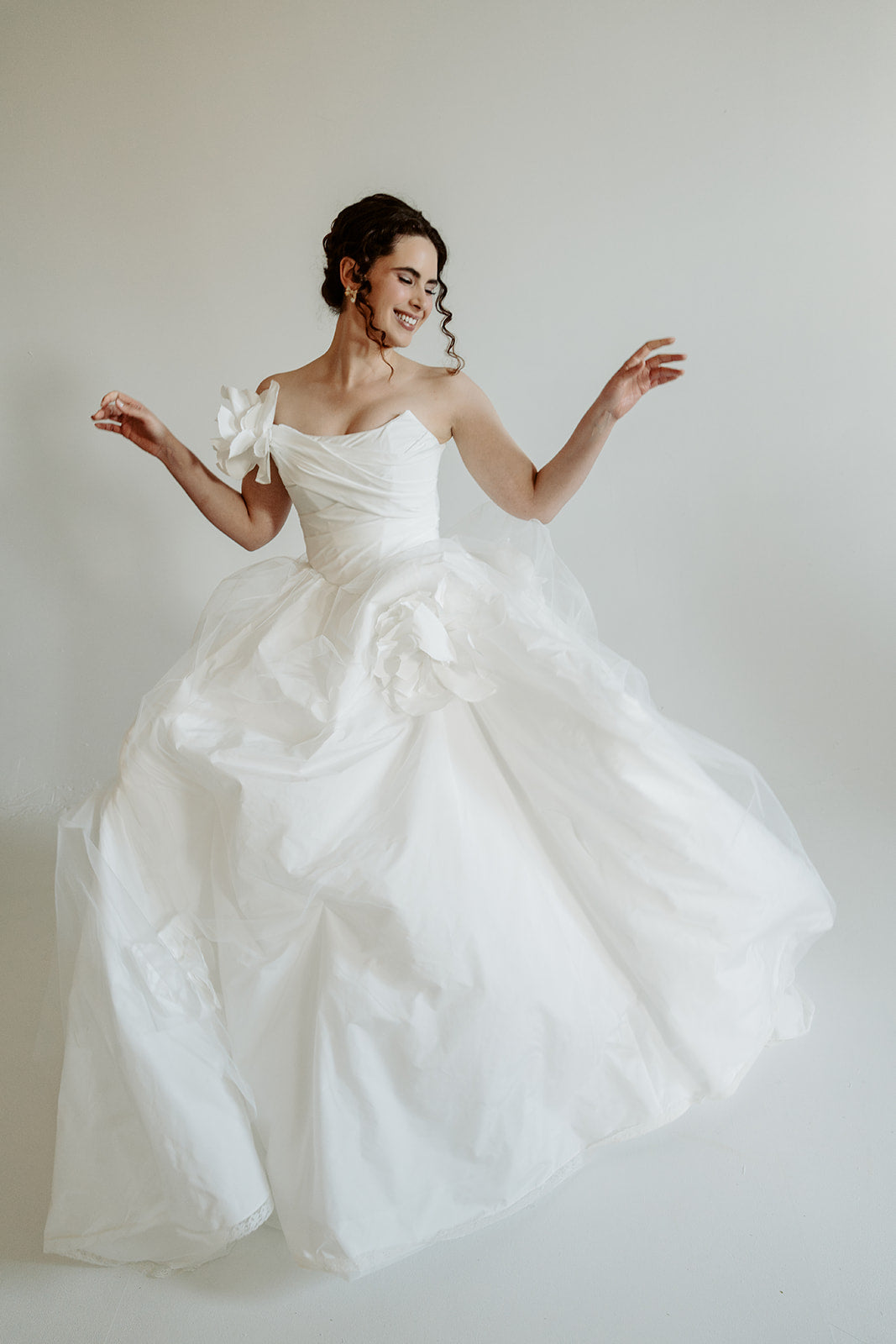 Made to measure designer corset wedding dress. Pleated top, lacing. Designed in our atelier in Toronto, Canada.