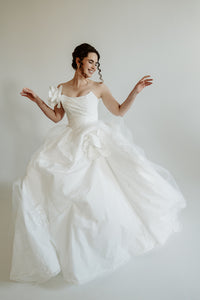 Made to measure designer corset wedding dress. Pleated top, lacing. Designed in our atelier in Toronto, Canada.