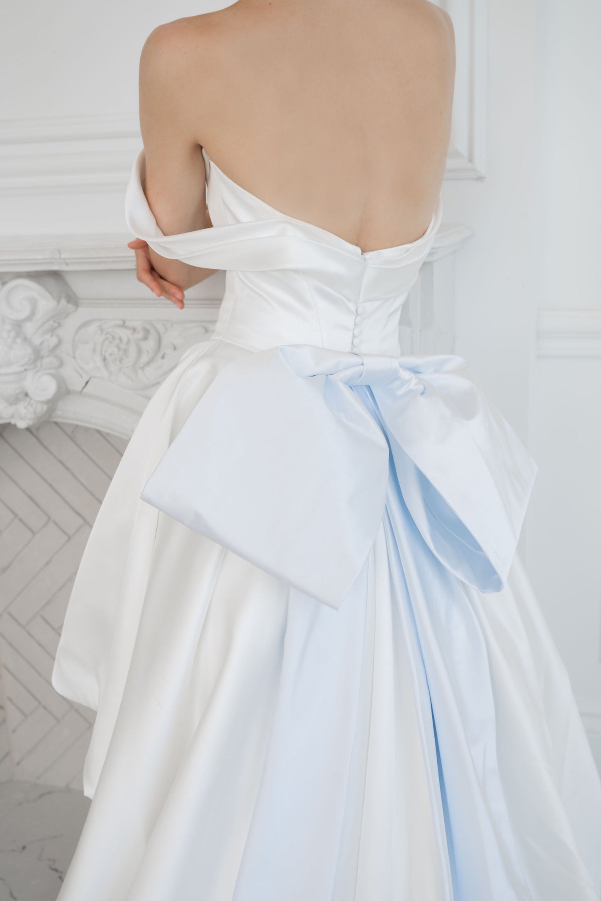 Dramatic satin wedding gown with a big bridal bow. Blue satin.  Demi couture wedding dresses by Catherine Langlois, Toronto. 