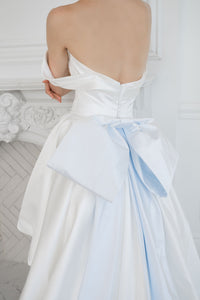 Dramatic satin wedding gown with a big bridal bow. Blue satin.  Demi couture wedding dresses by Catherine Langlois, Toronto. 