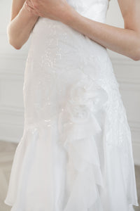 Elegant chiffon and beaded wedding dress. Square neckline, soft cap sleeves. Custom couture bridal gowns by Catherine Langlois, Toronto.