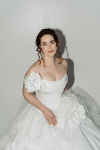 Made to measure designer corset wedding dress. Handmade roses on tulle and taffeta. Designed in our atelier in Toronto, Canada.