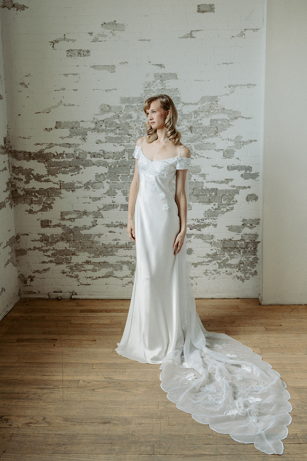 Vintage inspired satin bias empire line wedding dress. Embroidered train. Custom made in our Toronto Atelier.