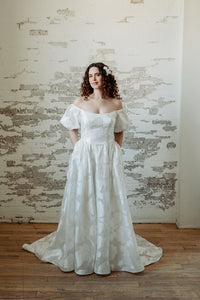 Romantic textured wedding dress. Off the shoulder, puffed sleeves. Handmade in Toronto, Canada.