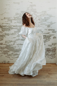 Romantic floral wedding dress. Off the shoulder, puffed sleeves. Custom made in our studio Toronto, Canada.