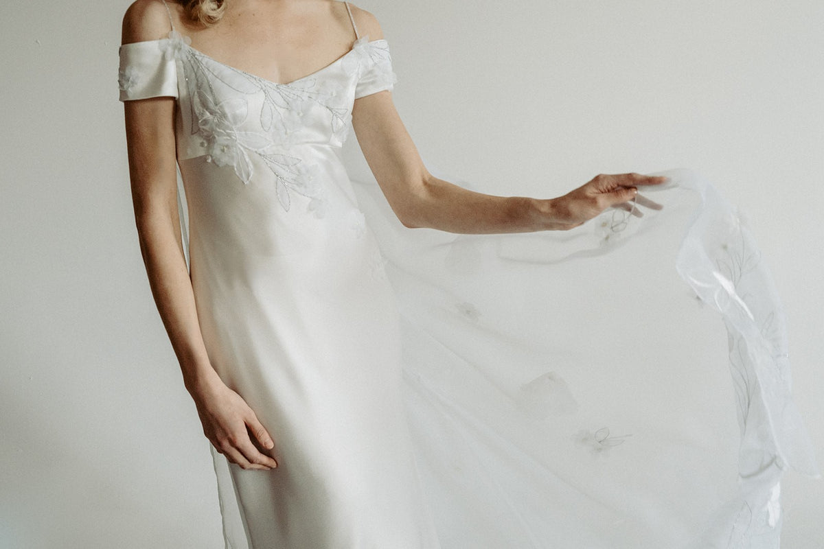 Vintage inspired satin bias wedding dress. Embroidered train. Made in Canada from reclaimed Italian fabric.