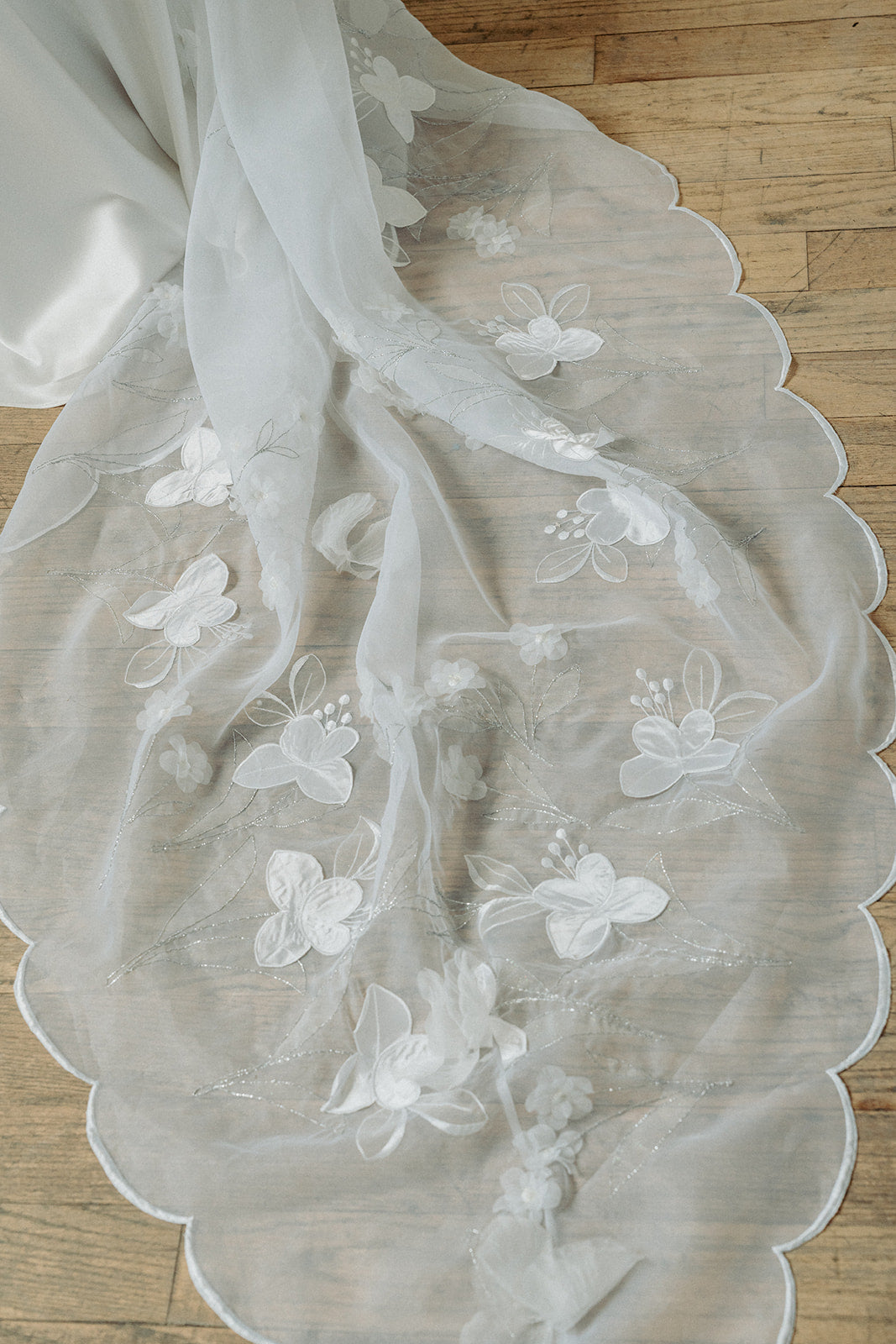 Vintage inspired satin bias empire line wedding dress. Embroidered train. Custom made in Toronto from reclaimed Italian fabric.