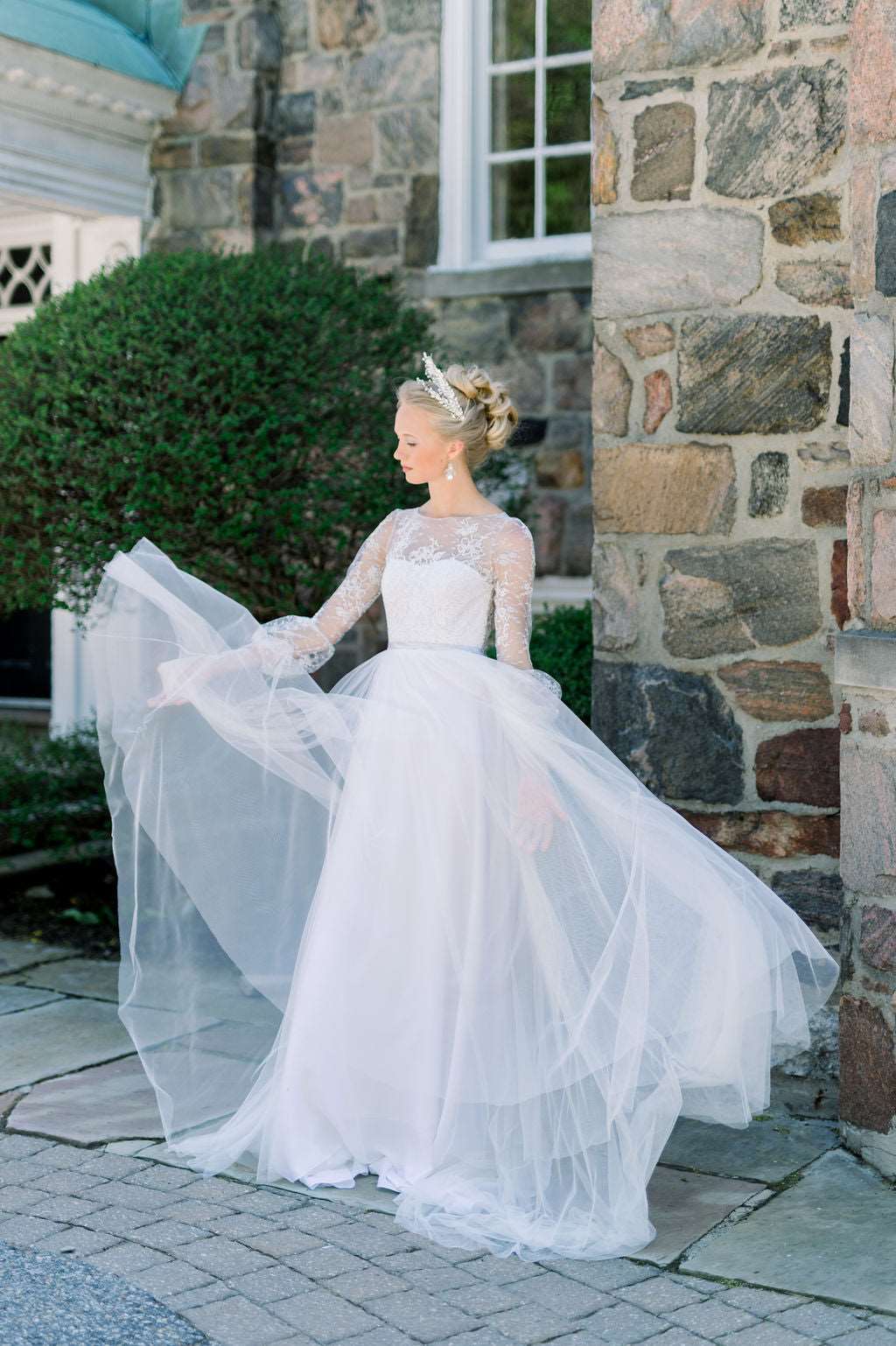 Romantic tulle wedding dress with boat neckline and long lace sleeves. Custom designed by Catherine Langlois, Toronto, Ontario, Canada.
