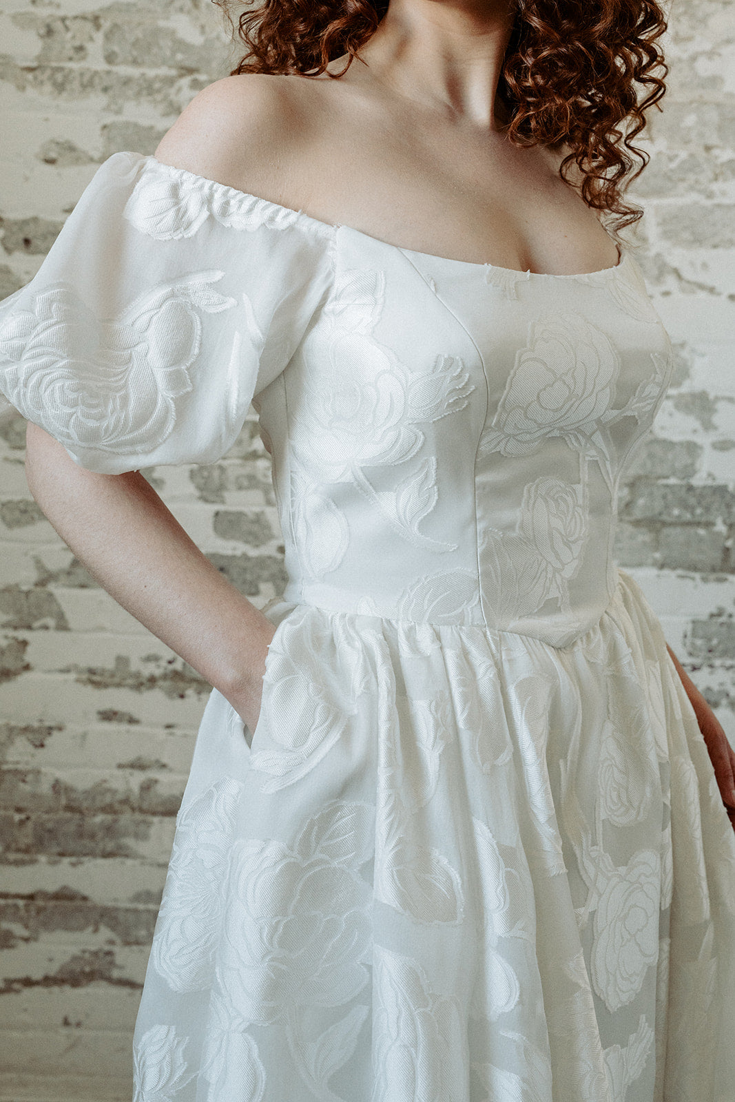 Romantic textured wedding dress. Off the shoulder, puffed sleeves. Custom made in Toronto, Canada.