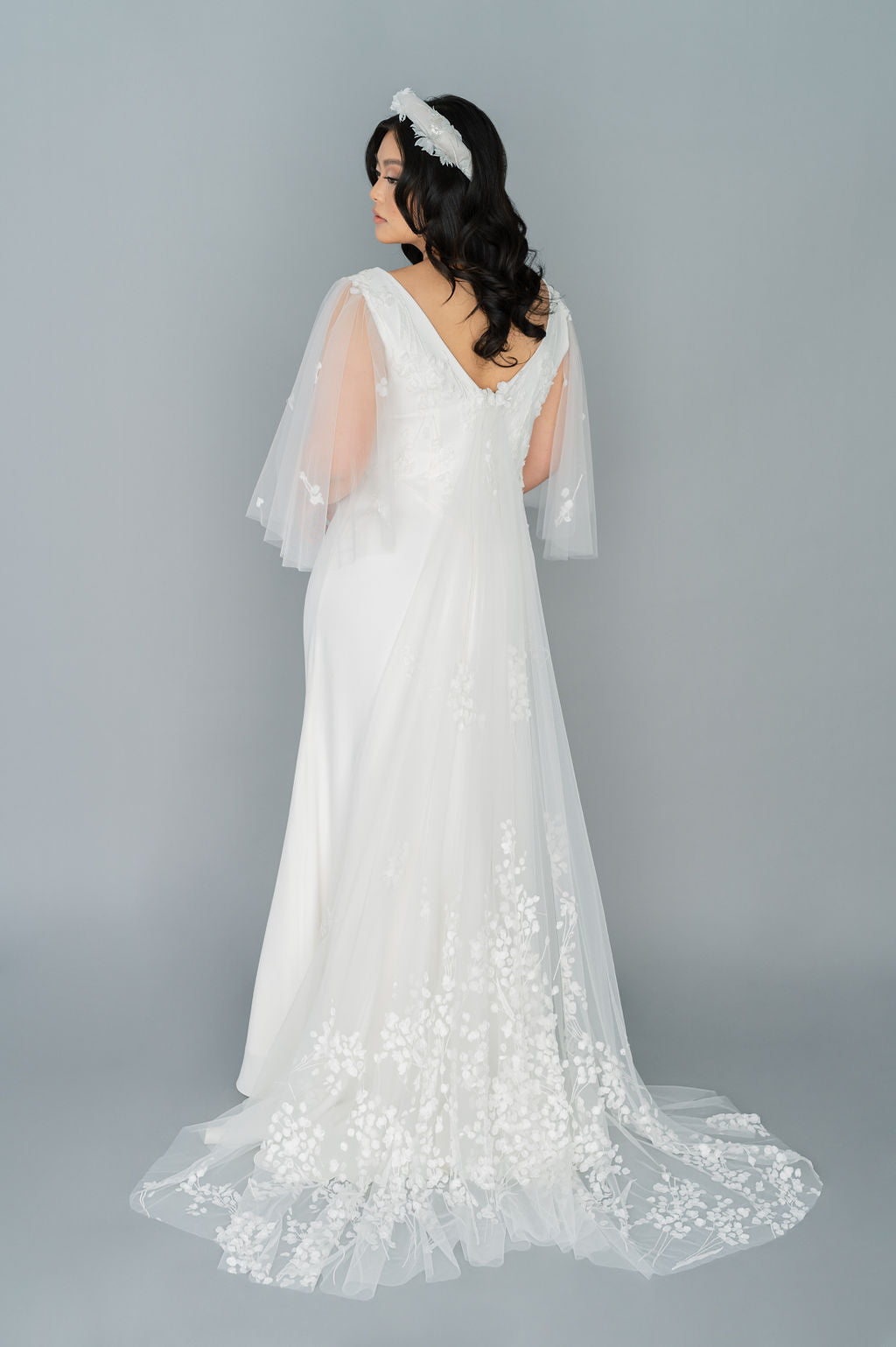 Elegant, simple off the rack wedding dress. Tulle sleeves and train. Made  in Toronto by Catherine Langlois