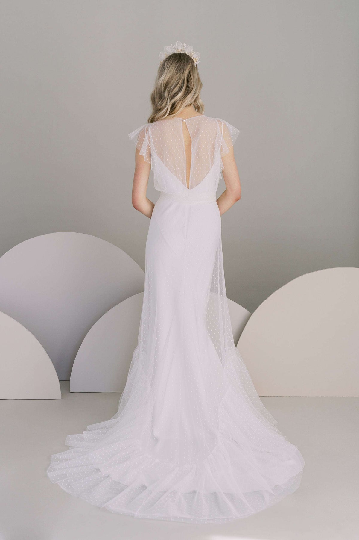 Nostalgic and romantic dot tulle wedding dress. Shown with a simple slip dress lining. Designed by Catherine Langlois, Canada.