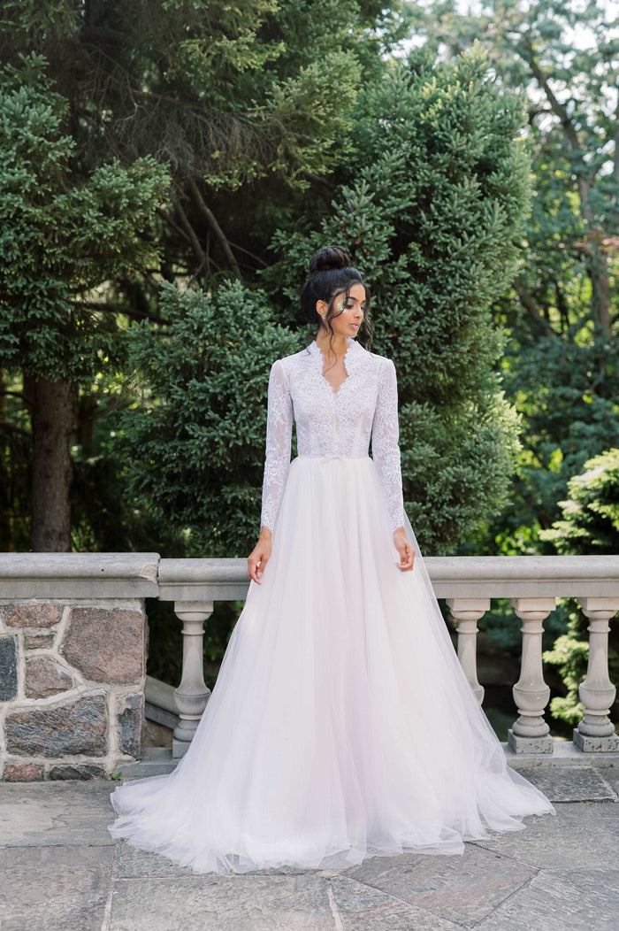 Romantic and whimsical avender tulle wedding dress. Classic lace and tulle A line silhouette. Designed by Catherine Langlois, Canada