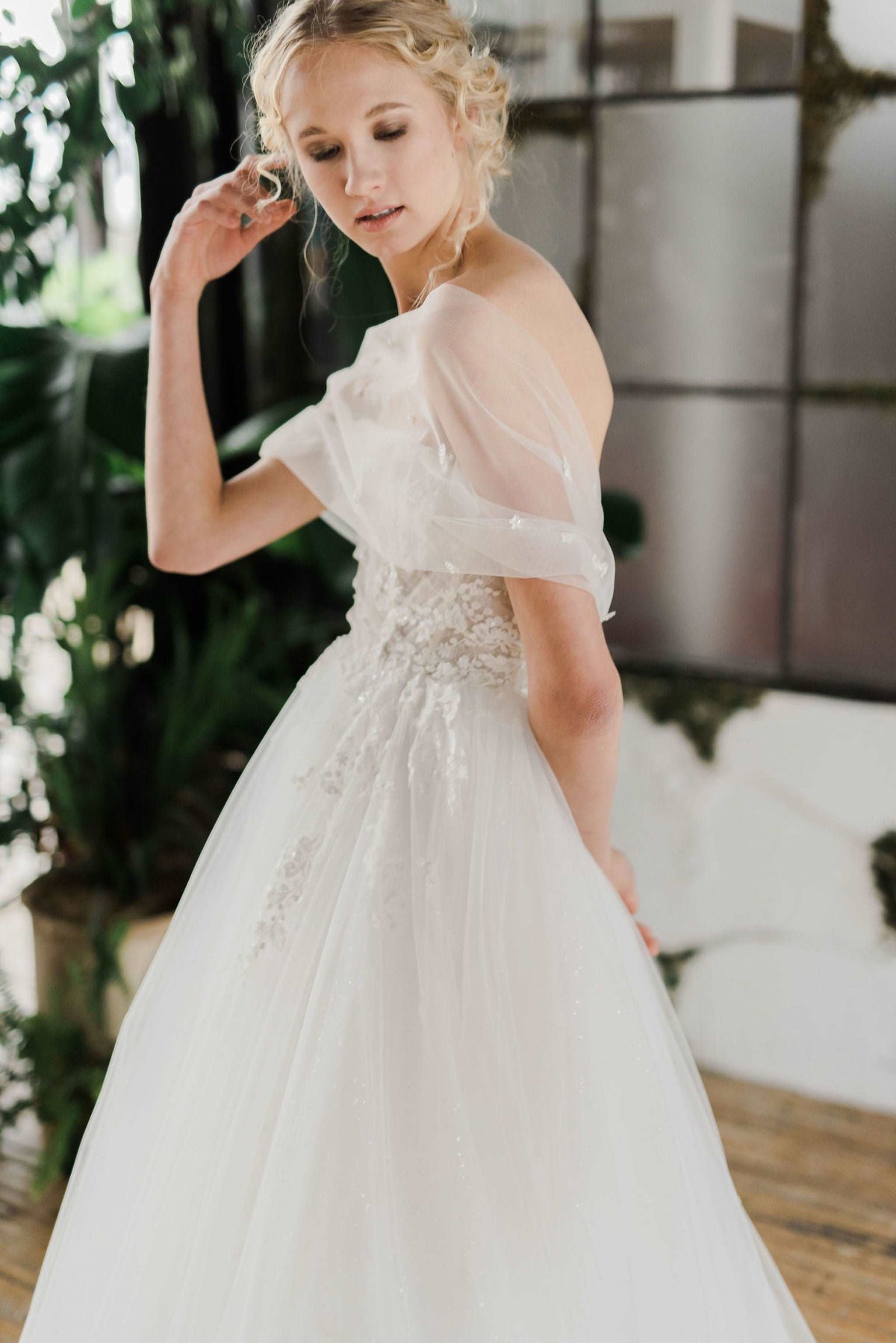 Be a modern princess in the beaded tulle Destiny wedding dress. Couture bespoke wedding gowns handmade in Canada by Catherine Langlois bridal. Visit our Toronto bridal boutique for your personalized wedding dress.
