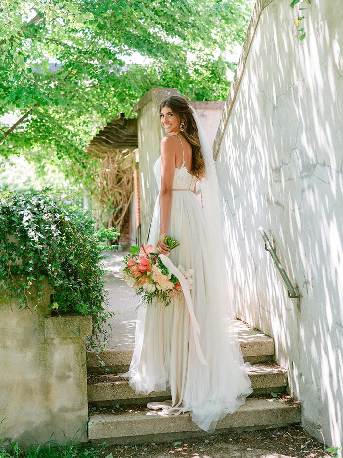 Custom Canadian wedding dresses. Romantic boho wedding dress by Catherine Langlois. Soft shades of milk, champagne and pewter silk and tulle with floral applique. 