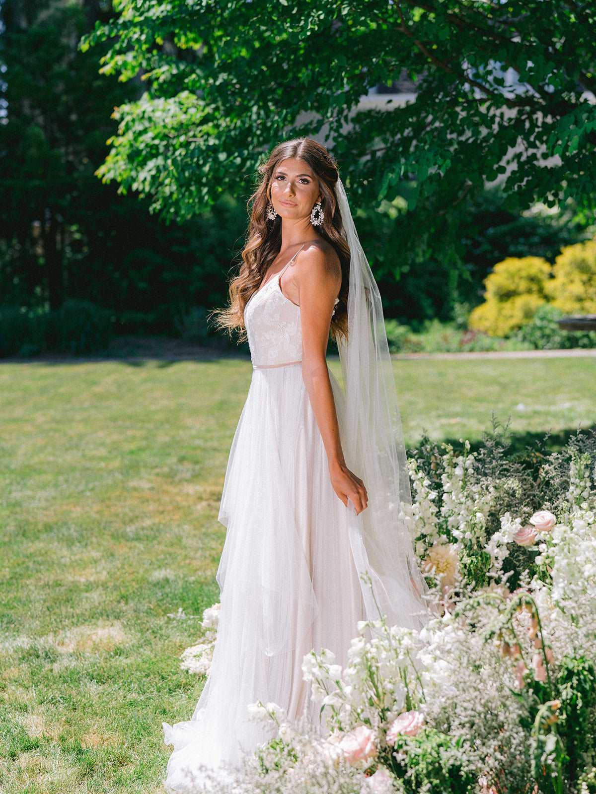 Romantic boho wedding dress by Catherine Langlois. Soft shades of milk, champagne and pewter silk and tulle with floral applique. Made to order in Toronto, Canada.