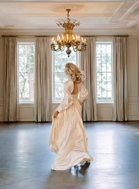 Glamourous silk satin wedding dress. Shown in blush. Designed by Catherine Langlois, Toronto, Canada.