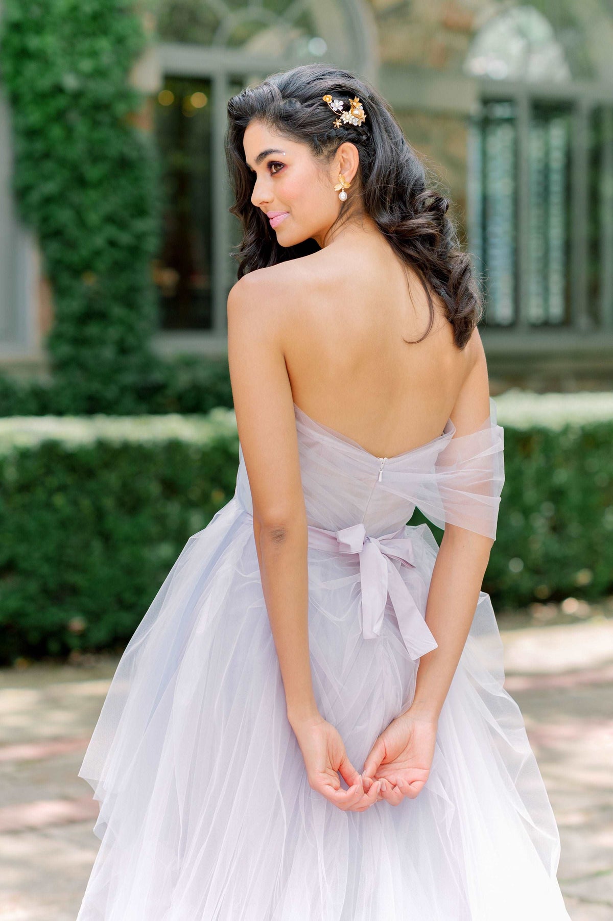 Ultimate fun whimsical wedding dress. Lavender tulle, ruffled skirt. Two piece wedding dress with short dress and overskirt. Bow detail. By Catherine Langlois, Toronto