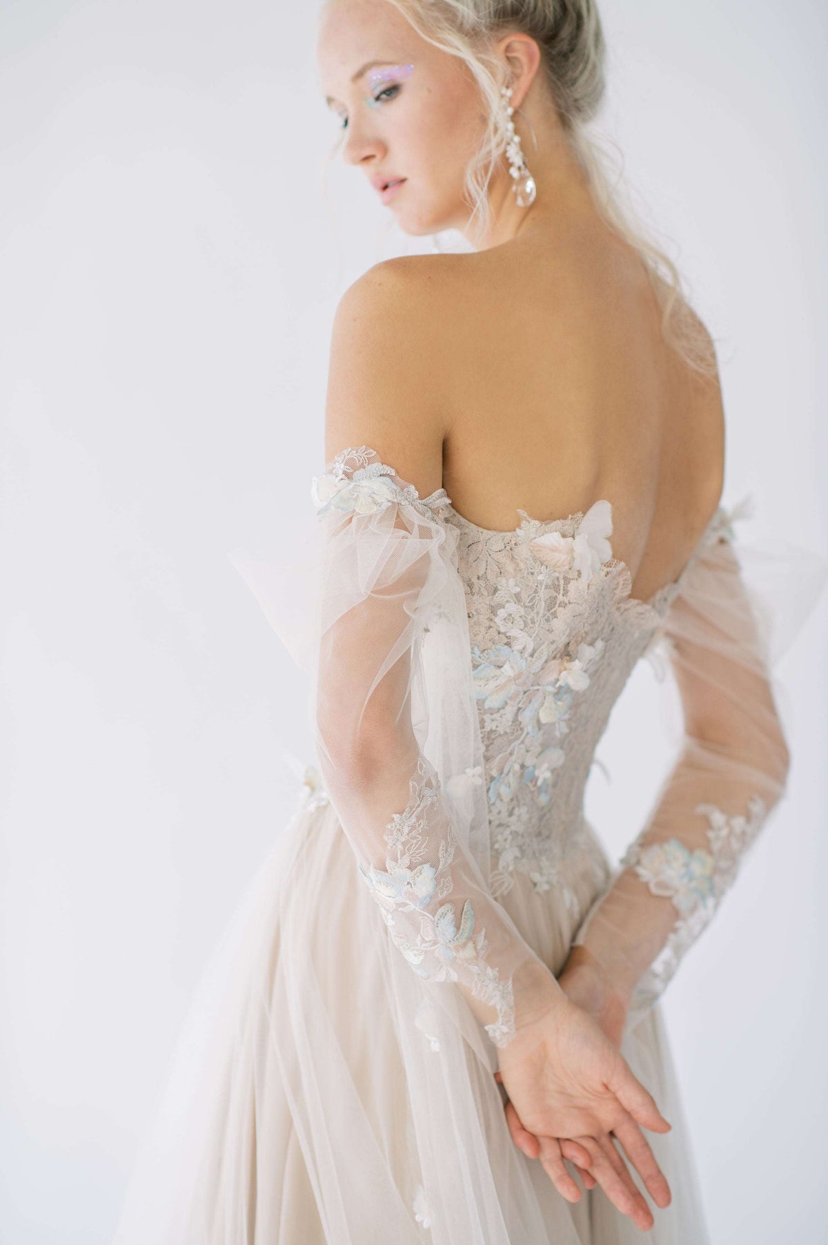 Timeless and romantic, whimsical blush silk and tulle wedding dress. Fairy tale floral applique. Off the shoulder, corset detailing. Custom made by Catherine Langlois, Canada