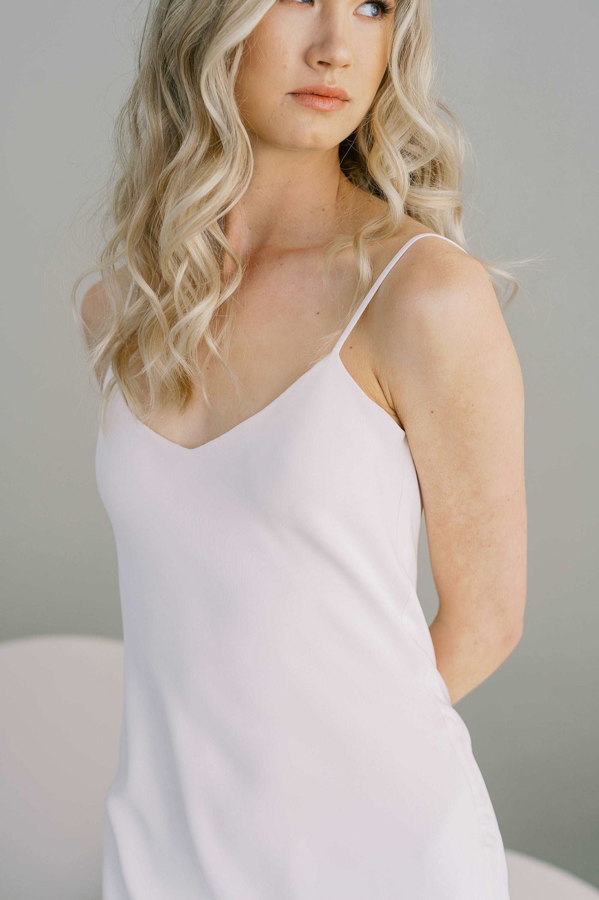 Simple slip wedding dress with a low v back. Available in silk or eco crepe. Made to order by Catherine Langlois, Toronto, Canada.