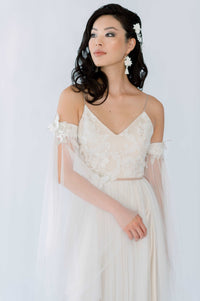 Romantic fairy core wedding dress in vintage floral lace. Designed by Catherine Langlois Bridal, Canada.
