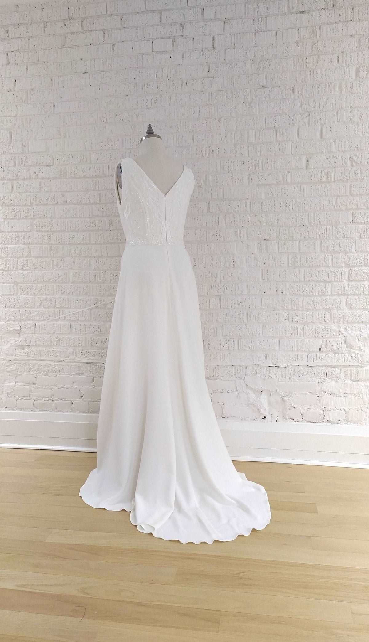 Shop Toronto bridal. Off the rack wedding dress. Size US 14. Crepe fit and flare simple wedding gown. Handmade in  our Toronto bridal boutique..