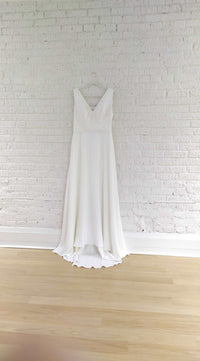 Off the rack wedding dress. Size 14, simple fit and flare crepe wedding gown. V neck, bra friendly wedding dress. Handmade in Toronto.