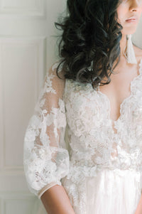 Timeless romantic tulle and french lace wedding dress. Elbow length sleeves, deep V back.Custom made wedding dress by Catherine Langlois, Toronto