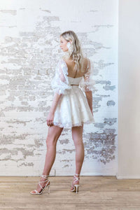 Puffy lace sleeve wedding crop top with mini skirt. Modern bridal separates. Made in Canada.