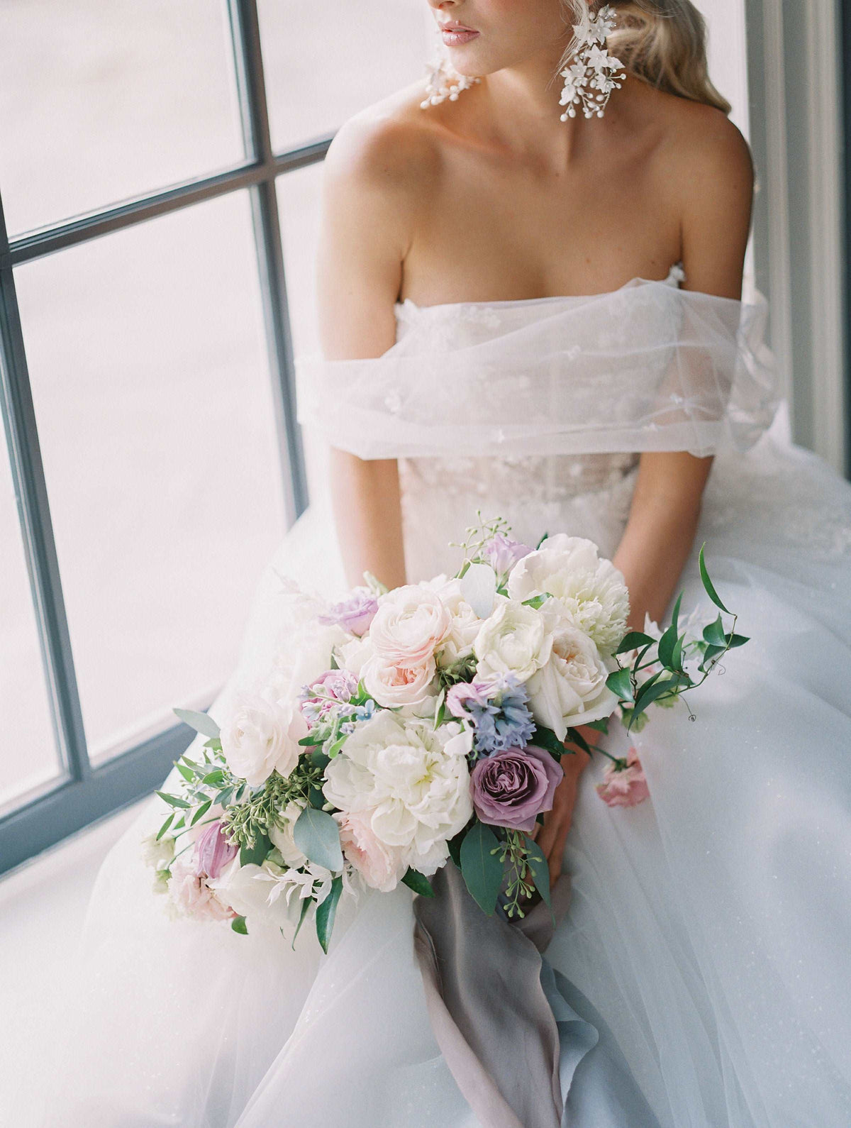 Ethereal off the shoulder Canadian wedding dress. Custom designed luxury wedding dresses custom made in Toronto. Shop our local Toronto bridal boutique..