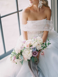 Ethereal off the shoulder Canadian wedding dress. Custom designed luxury wedding dresses custom made in Toronto. Shop our local Toronto bridal boutique..