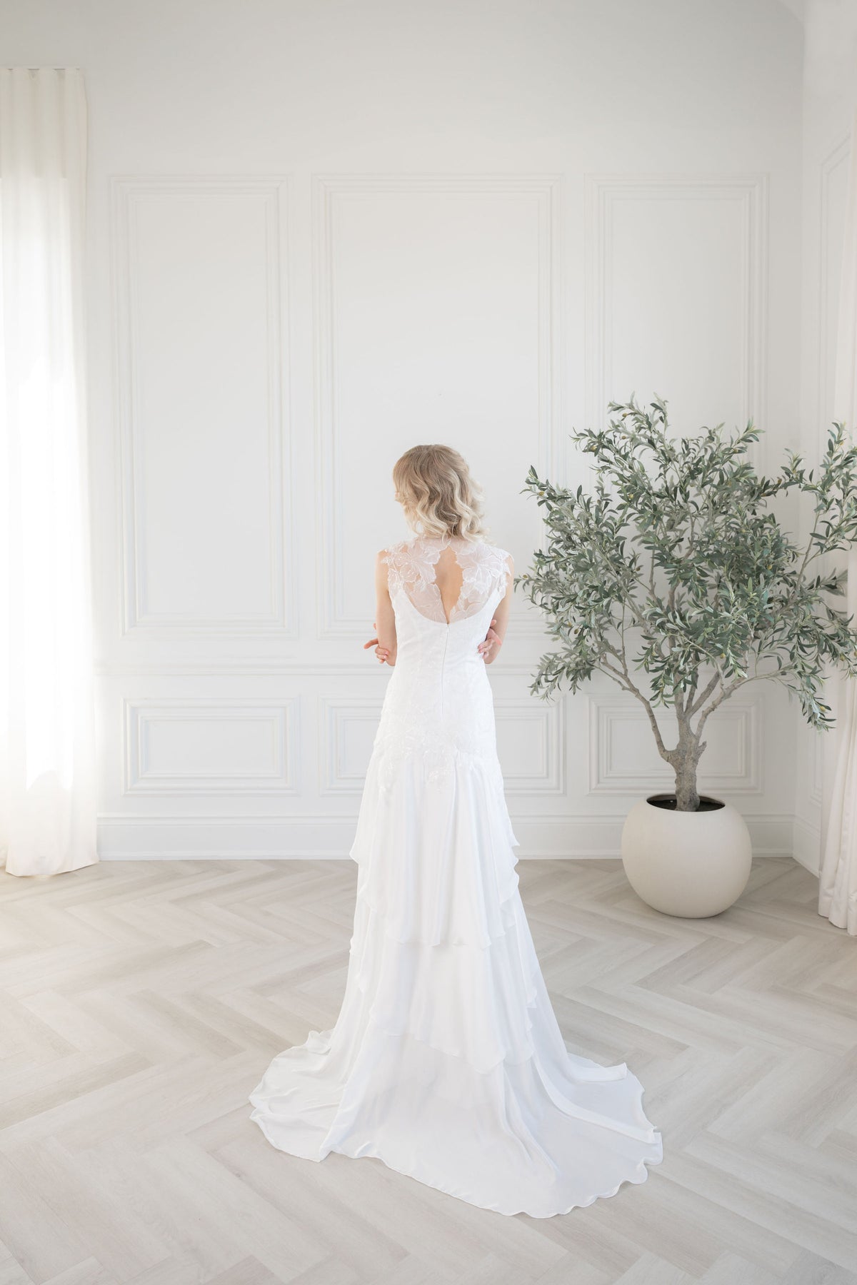 Elegant chiffon and beaded wedding dress for refined brides. Square neckline, soft cap sleeves. Custom couture bridal gowns by Catherine Langlois, Toronto.