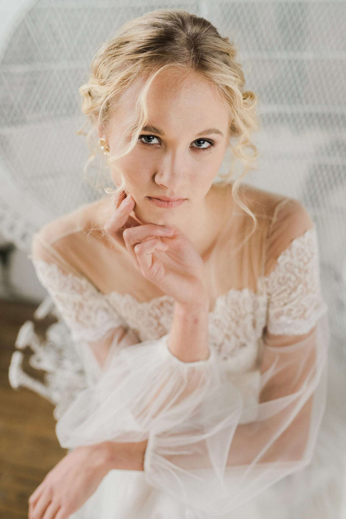 Delicate lace and tulle wedding dress with long sleeves by Catherine Langlois. Made to order in Toronto, Ontario, Canada. Photo by Destiny Dawn.