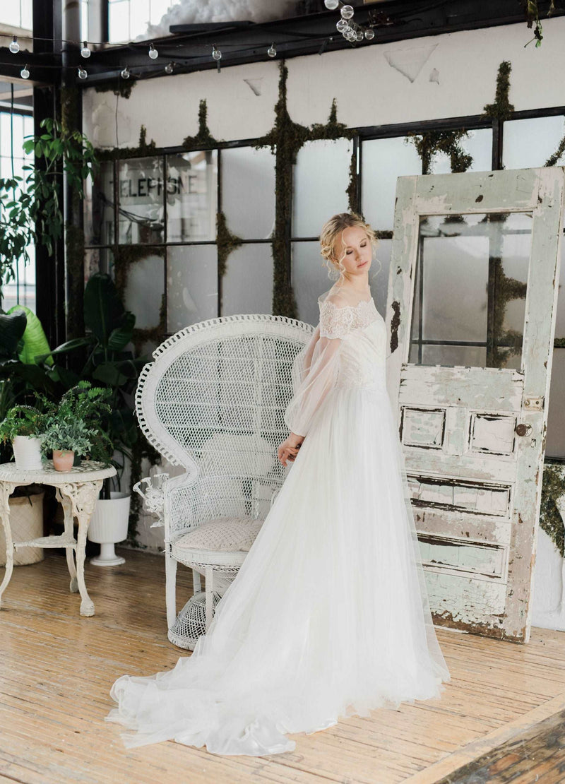 Delicate  lace and tulle wedding dress with long sleeves by Catherine Langlois. Made to order in Toronto, Ontario, Canada. Photo by Destiny Dawn.