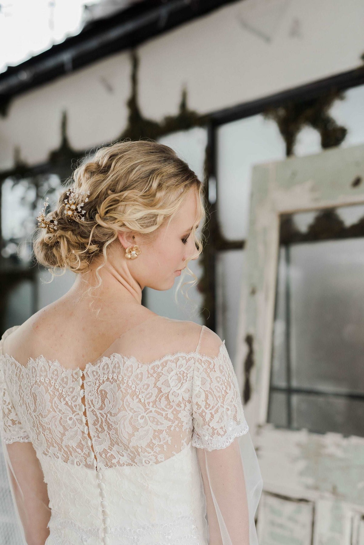 Delicate lace and tulle wedding dress with long sleeves by Catherine Langlois. Made to order in Toronto, Ontario, Canada. Photo by Destiny Dawn.