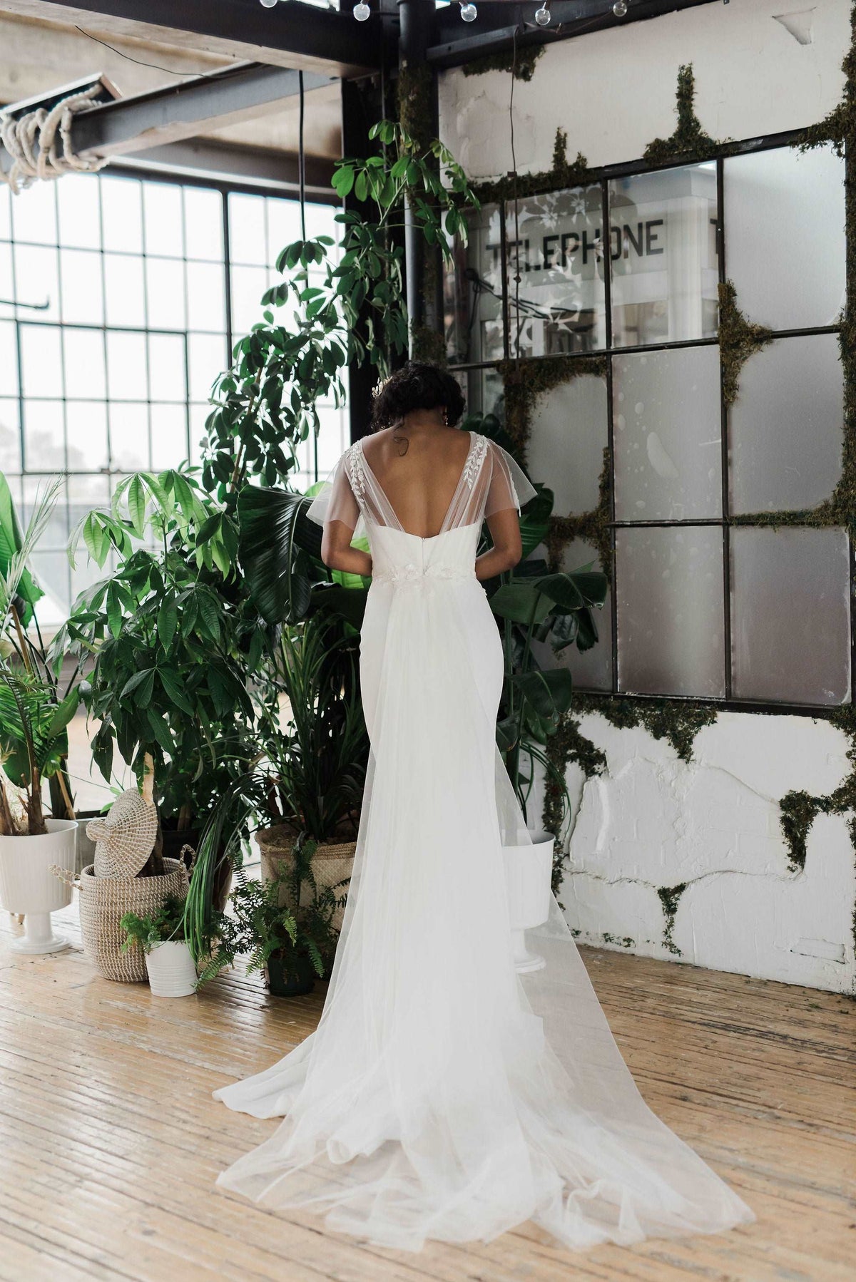 Simple and delicate slim crepe wedding dress with a detachable train. Designed by Catherine Langlois in Toronto, Ontario, Canada.