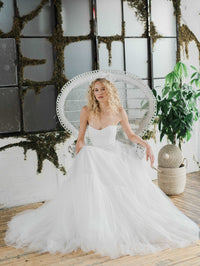 Meadow, a pretty Swiss dot tulle wedding dress. Designed and made by Catherine Langlois in Toronto, Ontario, Canada.