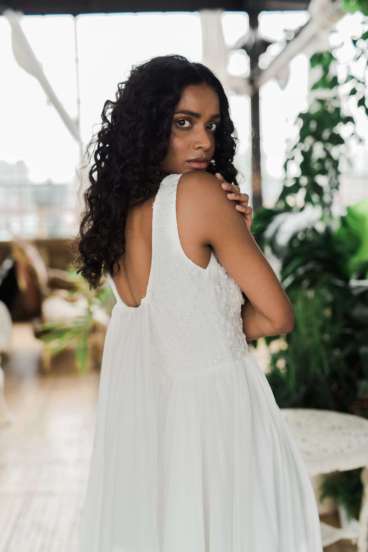 Floaty chiffon and silk wedding dress with a beaded top by Catherine Langlois. Made to order in Toronto, Ontario, Canada. Photo by Whitney Heard.