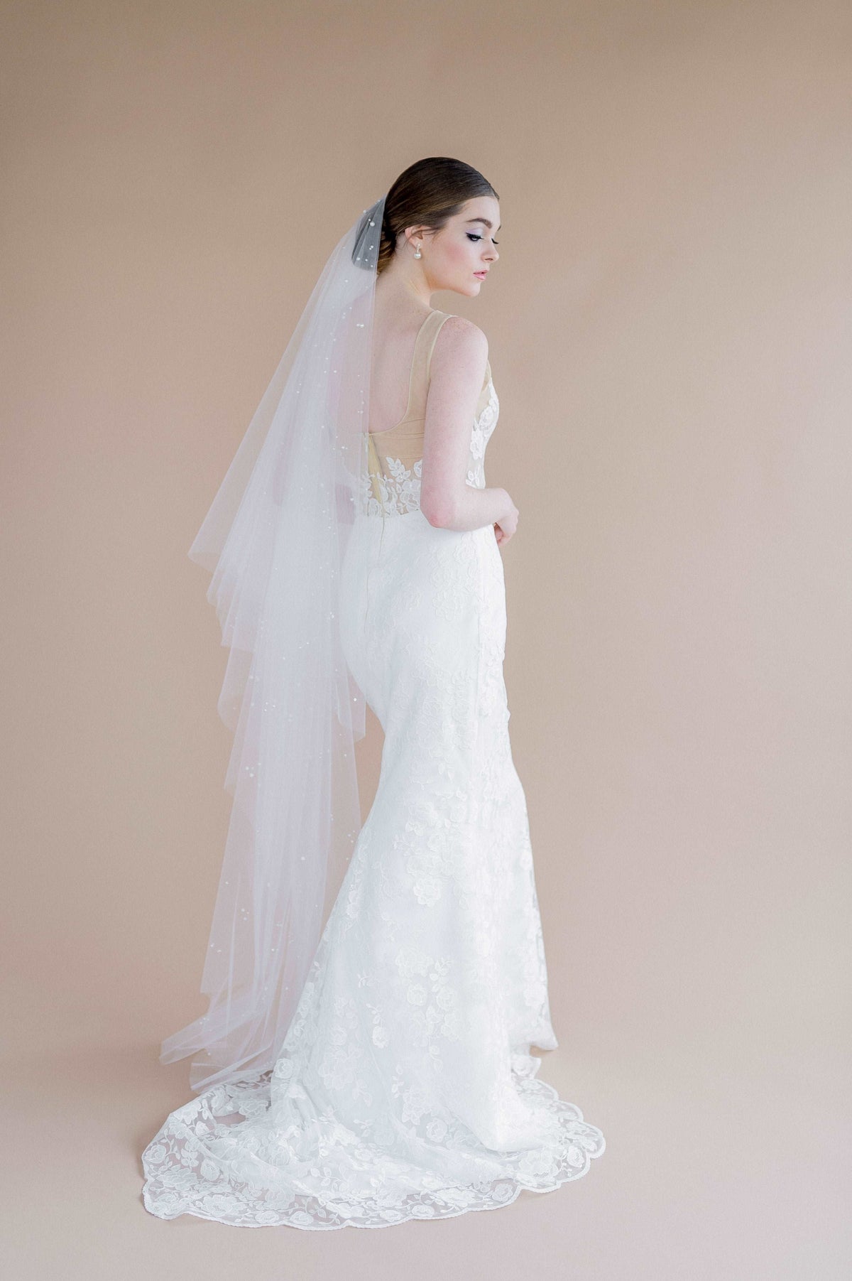 Marina, a modern shimmery floral lace wedding dress. Handmade in Toronto by Catherine Langlois Bridal Design.
