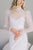 Victorian inspired high neck Chantilly lace wedding top with slim puff sleeves. Pearl buttons on the back. Handmade by Catherine Langlois, Toronto, Canada