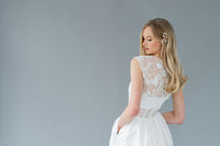 Playful romantic wedding dress, handmade by Catherine Langlois. Features pockets, a removable topper and corset detailing.