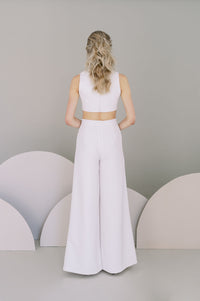 Cool bride wedding pants for an informal bridal outfit. Stretch crepe palazzo trousers with a tapered fit at the waist. Designed by Catherine Langlois, Canada.