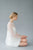 Short, fun wedding dress by Catherine Langlois. Beaded tulle with bell sleeves and a crepe slip. Made in Canada.