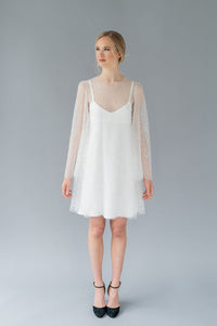 Short, fun wedding dress by Catherine Langlois. Beaded tulle with bell sleeves and a crepe slip. Made in Canada.