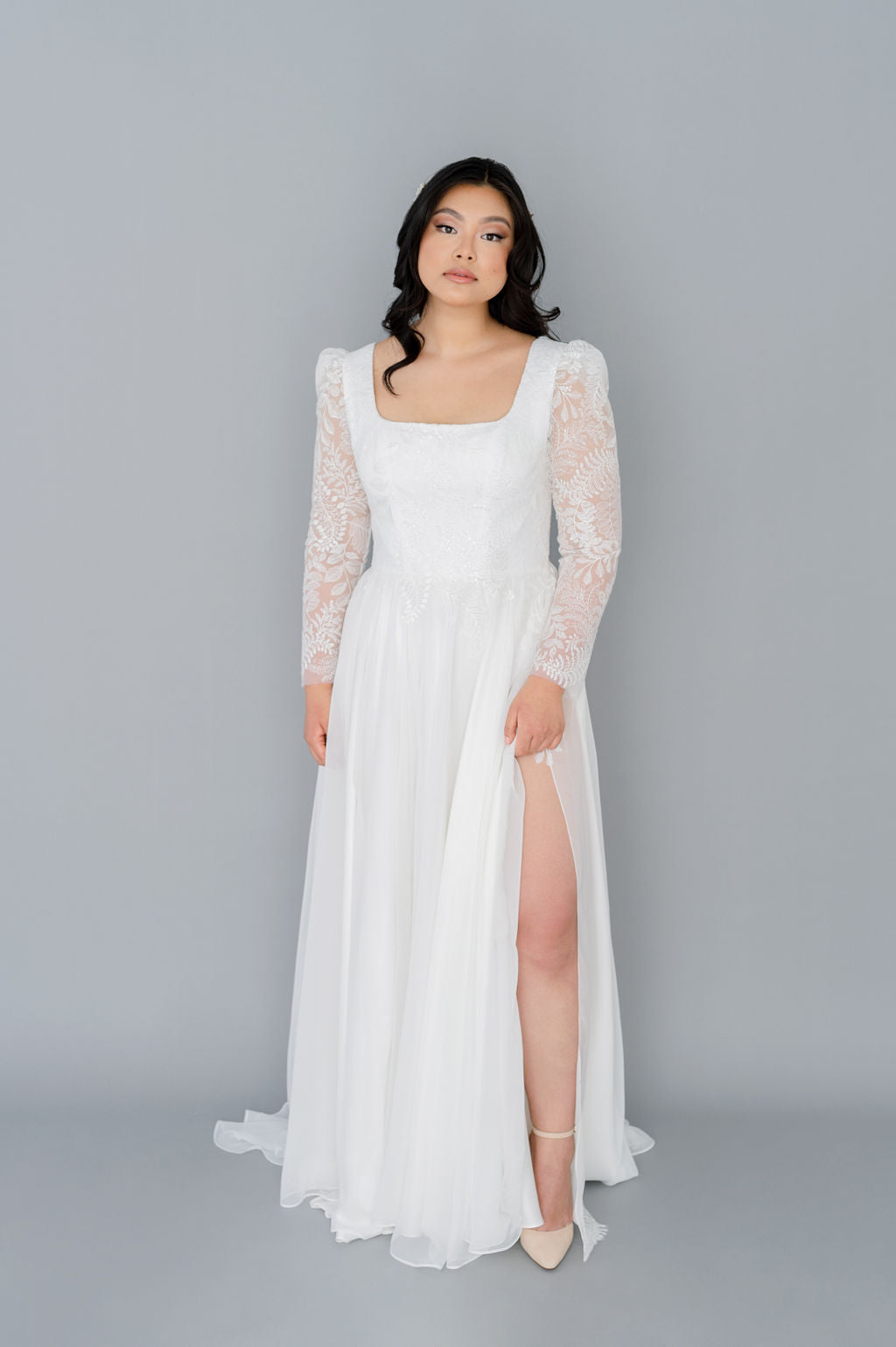 Romantic chiffon wedding dress with a square neckline. Full chiffon skirt, long lace sleeves, pearl buttons. Custom made by Catherine Langlois, Toronto.