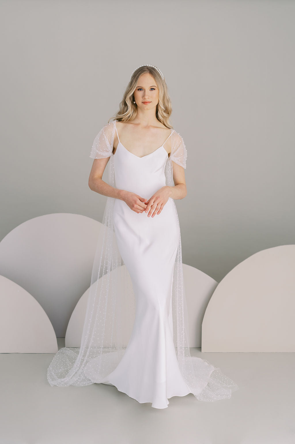 Long pearl bridal cape. Handmade by Catherine Langlois, Toronto, Canada.
