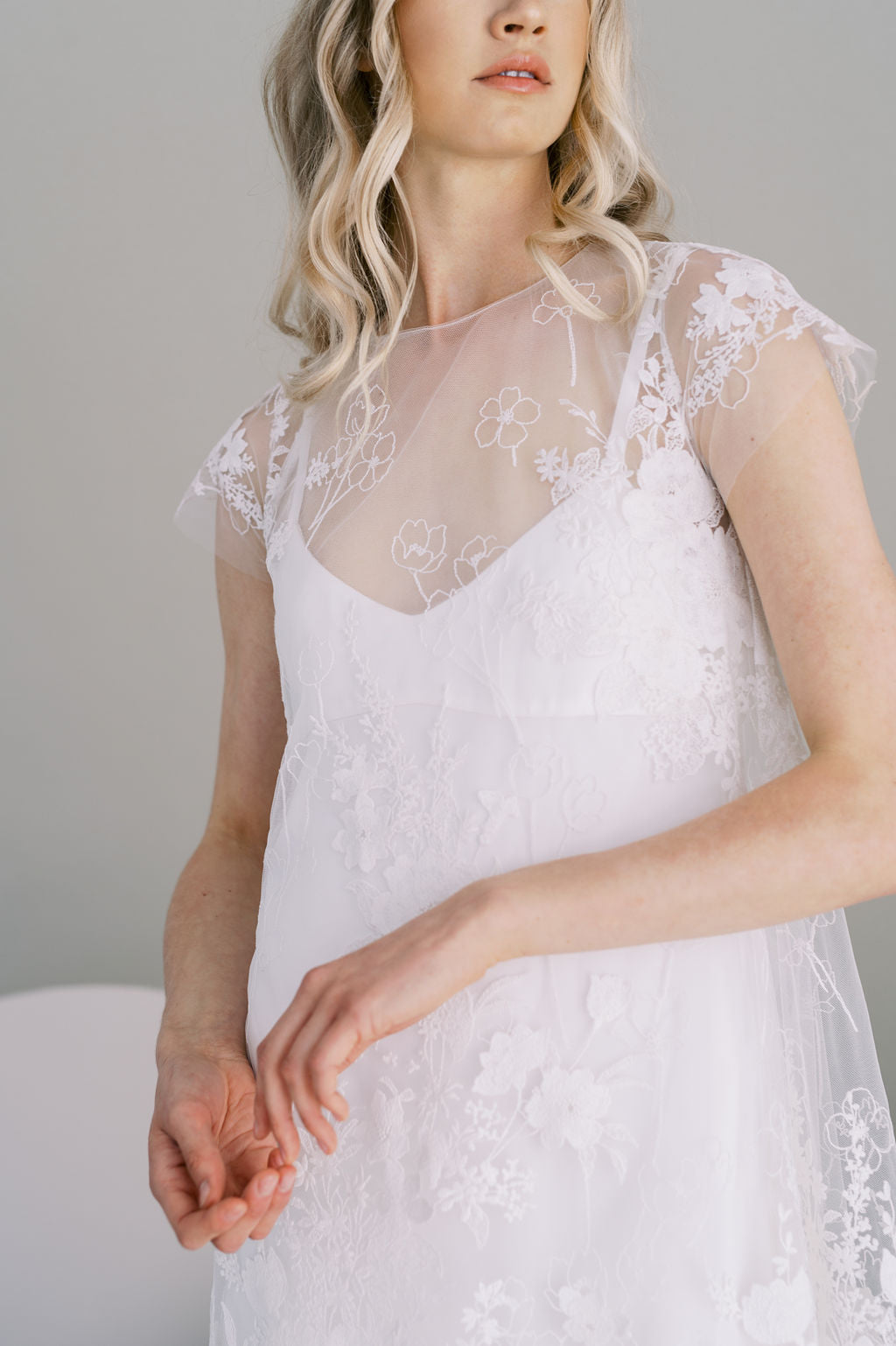 Knee length cotton botanical lace wedding dress. A line with cap sleeves and crepe slip. Handmade by Catherine Langlois, Toronto, Canada.