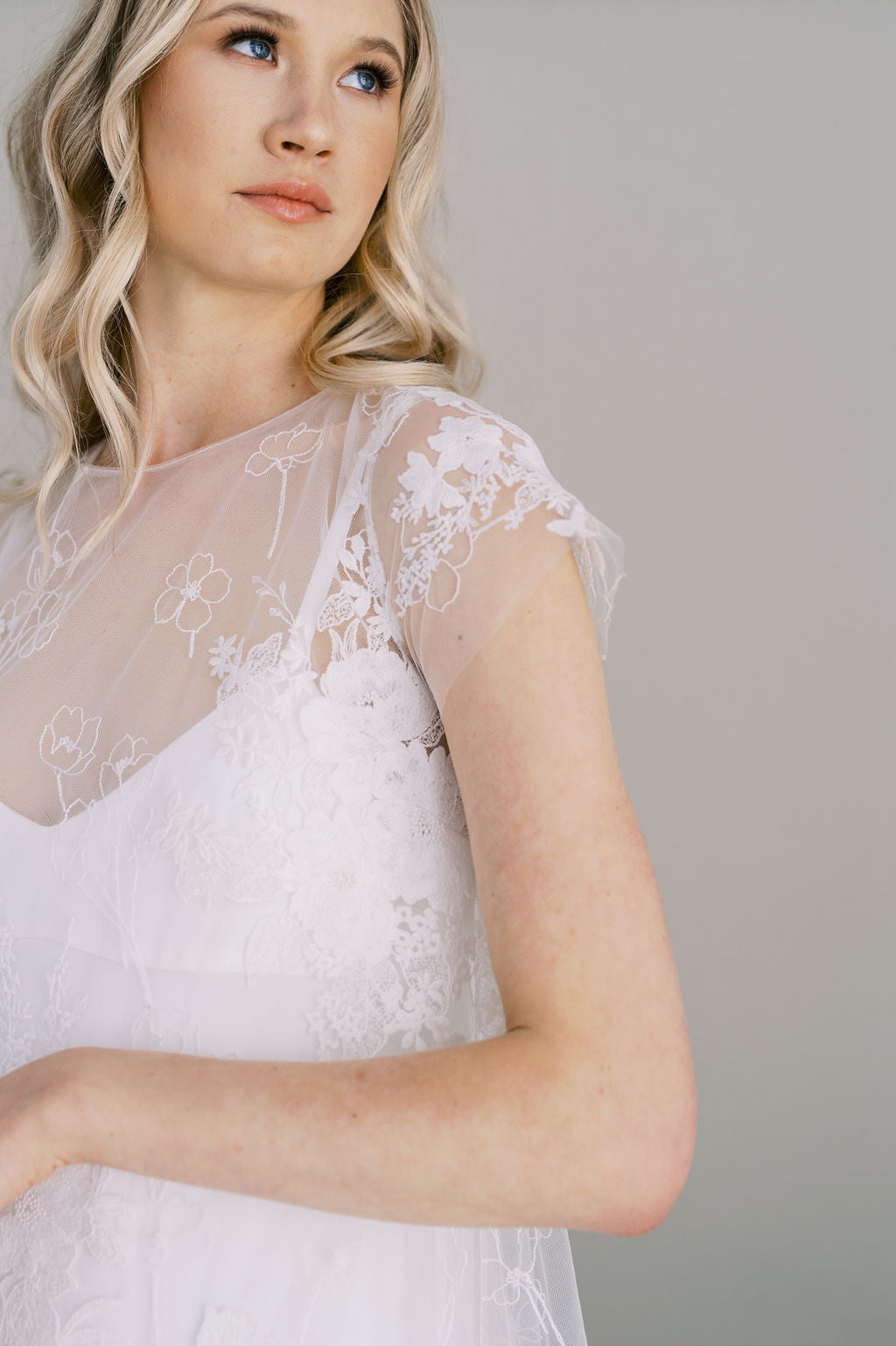 Short cotton boho lace wedding dress. A line with cap sleeves and crepe slip. Handmade by Catherine Langlois,Toronto, Canada.
