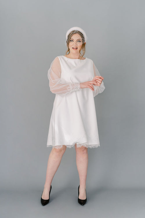 Short simple wedding dress in crepe with tulle poet sleeves. By Catherine Langlois, made in Canada.